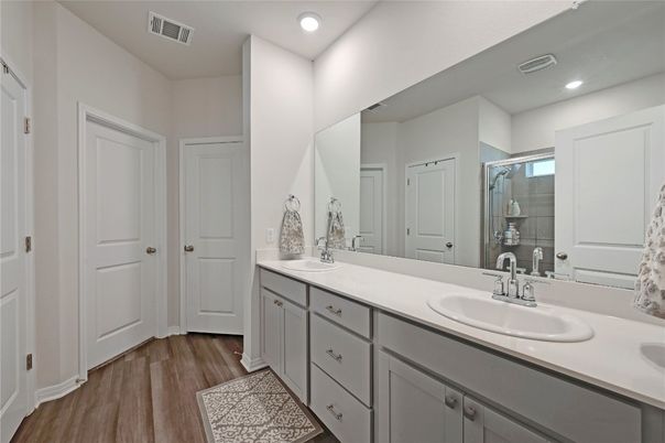 Bathroom, Dual Sink Vanities, Interior, Recessed Lighting, Wood Texture Flooring