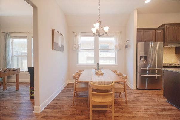 Chandelier, Dining room, Interior, Kitchen, Pendant Lights, Recessed Lighting, Stainless Steel Appliances, Wood Texture Flooring