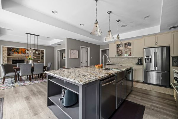Dining room, Fireplace, Interior, Kitchen, Pendant Lights, Recessed Lighting, Stainless Steel Appliances, Wood Texture Flooring