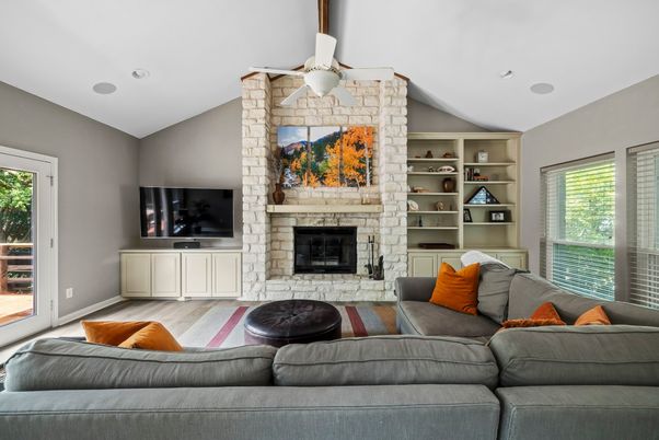 Fireplace, Interior, Living room, Recessed Lighting, Stone Walls, Wood Texture Flooring