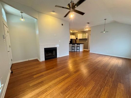 Empty room, Fireplace, Interior, Kitchen, Pendant Lights, Wood Texture Flooring