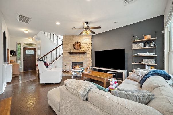 Fireplace, Interior, Living room, Recessed Lighting, Stone Walls, Wood Texture Flooring