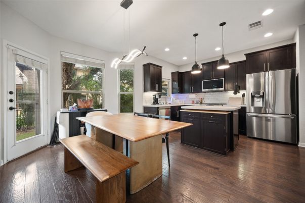 Dining room, Interior, Kitchen, Pendant Lights, Recessed Lighting, Stainless Steel Appliances, Wood Texture Flooring