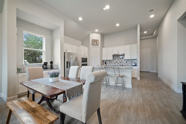 Dining room, Interior, Kitchen, Recessed Lighting, Stainless Steel Appliances, Wood Texture Flooring