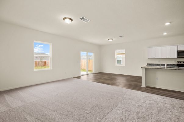Empty room, Interior, Kitchen, Recessed Lighting, Stainless Steel Appliances, Wood Texture Flooring