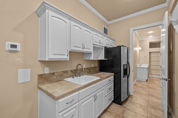 Interior, Kitchen, Recessed Lighting, Tile Countertops, Washer