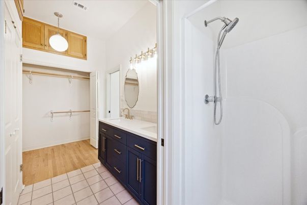 Bathroom, Dual Sink Vanities, Interior, Pendant Lights, Walk-in Closets, Wood Texture Flooring
