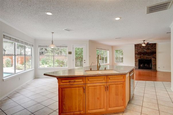 Empty room, Fireplace, Interior, Kitchen, Pendant Lights, Recessed Lighting, Wood Texture Flooring