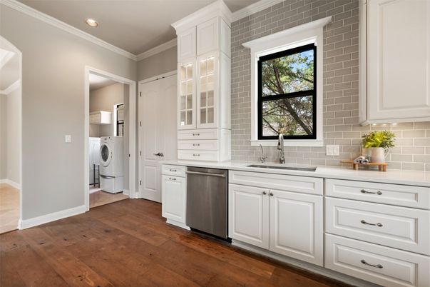 Interior, Kitchen, Recessed Lighting, Stainless Steel Appliances, Stone Walls, Washer, Wood Texture Flooring