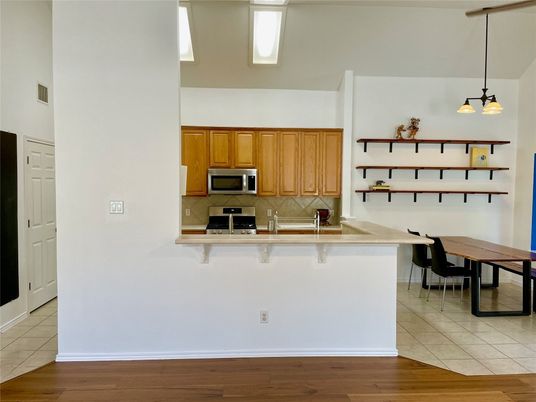 Dining room, Interior, Kitchen, Pendant Lights, Stainless Steel Appliances, Wood Texture Flooring
