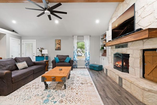 Fireplace, Interior, Living room, Recessed Lighting, Stone Walls, Wood Texture Flooring