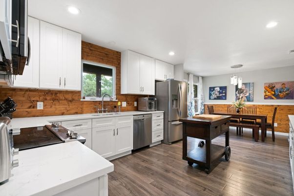 Dining room, Interior, Kitchen, Pendant Lights, Recessed Lighting, Stainless Steel Appliances, Wood Texture Flooring
