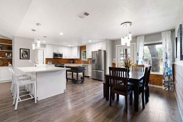 Dining room, Interior, Kitchen, Pendant Lights, Recessed Lighting, Stainless Steel Appliances, Wood Texture Flooring