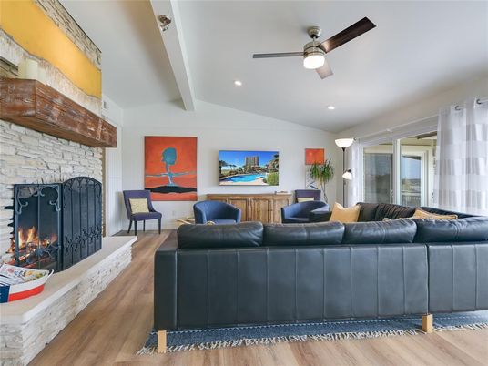 Fireplace, Interior, Living room, Recessed Lighting, Stone Walls, Wood Texture Flooring