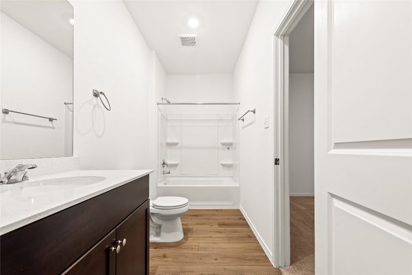 Bathroom, Dual Sink Vanities, Interior, Recessed Lighting, Wood Texture Flooring