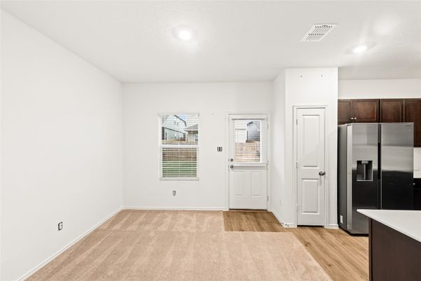 Empty room, Interior, Kitchen, Recessed Lighting, Stainless Steel Appliances, Wood Texture Flooring