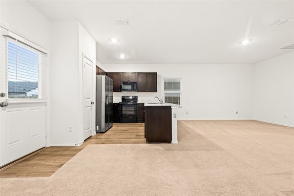 Empty room, Interior, Kitchen, Recessed Lighting, Stainless Steel Appliances, Wood Texture Flooring