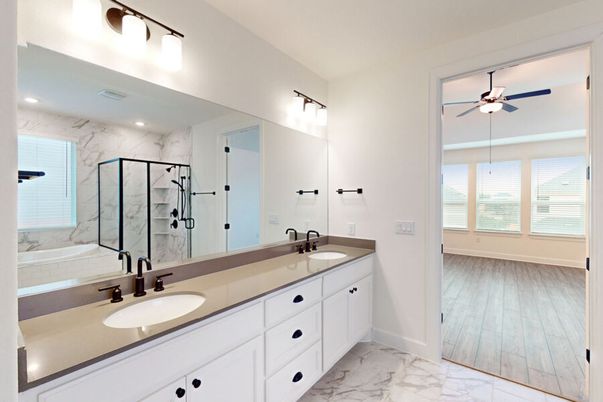Bathroom, Dual Sink Vanities, Glass Shower, Interior, Marble, Marble Walls, Recessed Lighting, Wood Texture Flooring