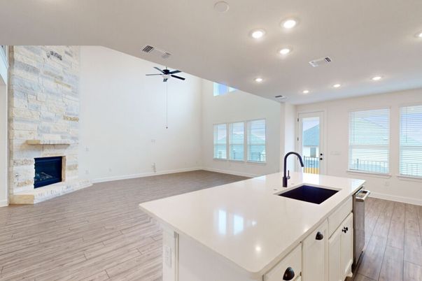 Empty room, Fireplace, Interior, Kitchen, Recessed Lighting, Stone Walls, Wood Texture Flooring