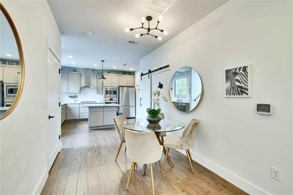 Dining room, Interior, Kitchen, Pendant Lights, Recessed Lighting, Stainless Steel Appliances, Wood Texture Flooring