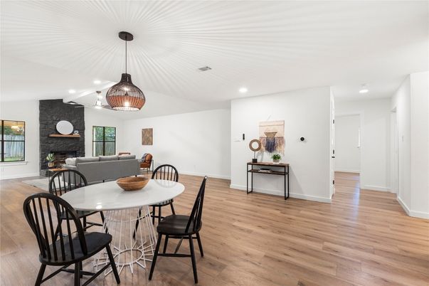 Dining room, Fireplace, Interior, Pendant Lights, Recessed Lighting, Stone Walls, Wood Texture Flooring