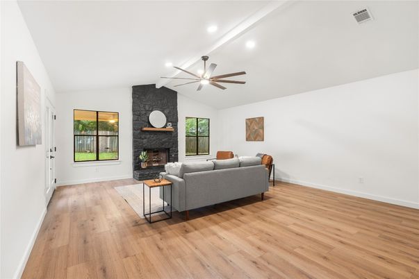Fireplace, Interior, Living room, Recessed Lighting, Stone Walls, Wood Texture Flooring