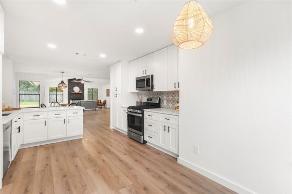 Interior, Kitchen, Pendant Lights, Recessed Lighting, Stainless Steel Appliances, Wood Texture Flooring