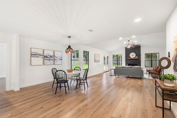 Dining room, Fireplace, Interior, Living room, Pendant Lights, Recessed Lighting, Wood Texture Flooring