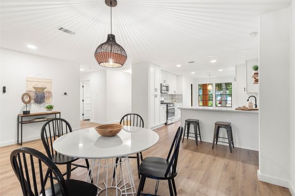 Dining room, Interior, Kitchen, Pendant Lights, Recessed Lighting, Stainless Steel Appliances, Wood Texture Flooring