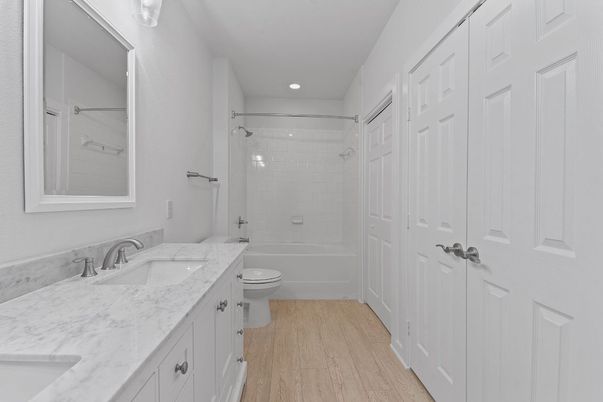 Bathroom, Dual Sink Vanities, Interior, Recessed Lighting, Wood Texture Flooring