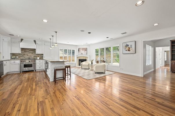Fireplace, Interior, Kitchen, Living room, Pendant Lights, Recessed Lighting, Stainless Steel Appliances, Wood Texture Flooring