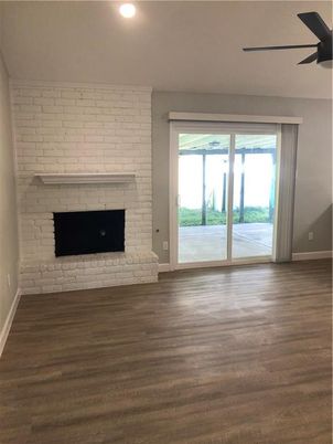 Empty room, Fireplace, Interior, Recessed Lighting, Stone Walls, Wood Texture Flooring