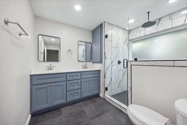 Bathroom, Dual Sink Vanities, Glass Shower, Interior, Marble Walls, Recessed Lighting