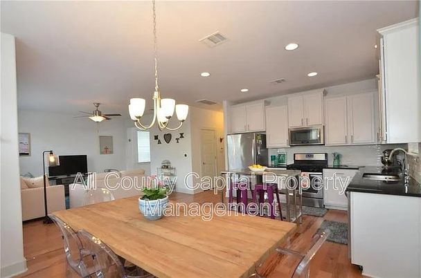 Chandelier, Dining room, Interior, Kitchen, Living room, Recessed Lighting, Stainless Steel Appliances, Wood Texture Flooring