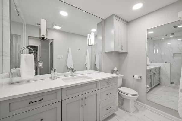 Bathroom, Dual Sink Vanities, Glass Shower, Interior, Marble, Marble Walls, Recessed Lighting