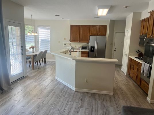 Chandelier, Dining room, Interior, Kitchen, Pendant Lights, Stainless Steel Appliances, Wood Texture Flooring