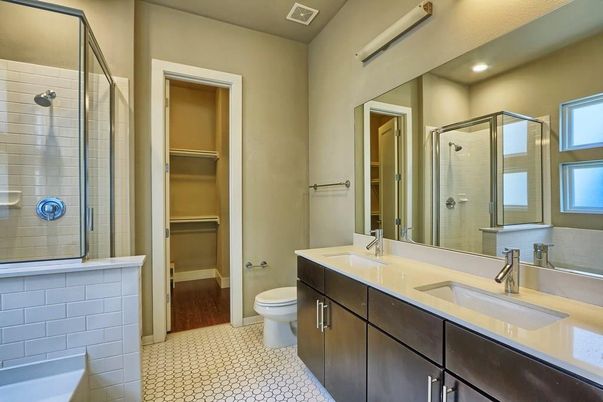 Bathroom, Dual Sink Vanities, Glass Shower, Interior, Recessed Lighting, Wood Texture Flooring