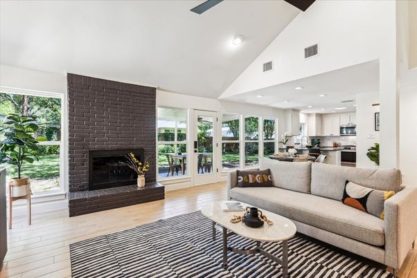 Dining room, Fireplace, Interior, Kitchen, Living room, Recessed Lighting, Stainless Steel Appliances, Wood Texture Flooring