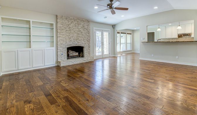 Empty room, Fireplace, Interior, Kitchen, Pendant Lights, Recessed Lighting, Stone Walls, Wood Texture Flooring