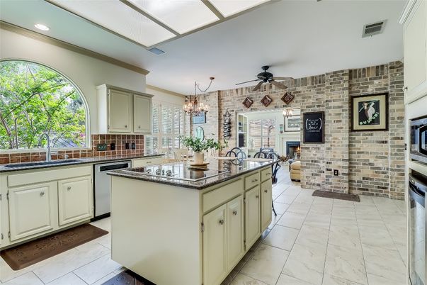 Chandelier, Fireplace, Interior, Kitchen, Recessed Lighting, Stainless Steel Appliances, Stone Walls