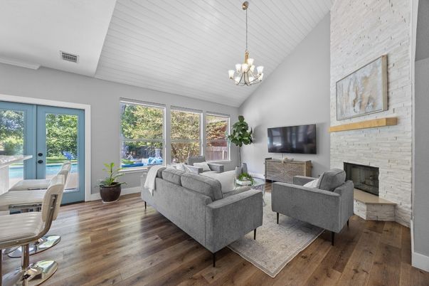 Chandelier, Fireplace, Interior, Living room, Pendant Lights, Stone Walls, Wood Texture Flooring