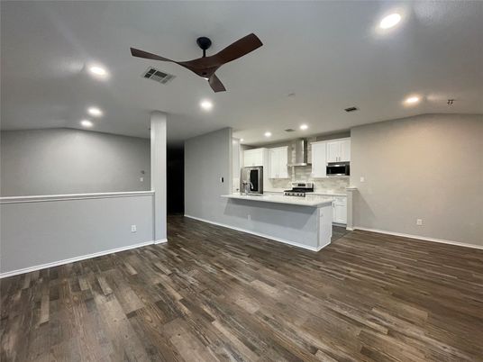 Empty room, Interior, Kitchen, Recessed Lighting, Stainless Steel Appliances, Wood Texture Flooring