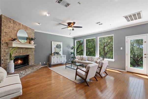 Fireplace, Interior, Living room, Recessed Lighting, Stone Walls, Wood Texture Flooring