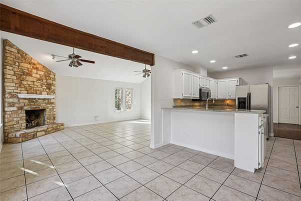 Empty room, Fireplace, Interior, Kitchen, Recessed Lighting, Stone Walls, Wooden Beams