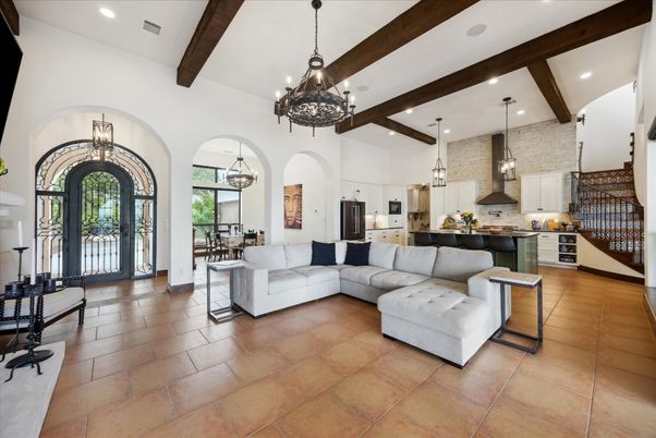Chandelier, Dining room, Interior, Kitchen, Living room, Pendant Lights, Recessed Lighting, Stainless Steel Appliances, Wooden Beams