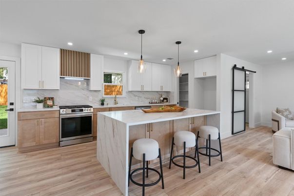 Interior, Kitchen, Marble Walls, Pendant Lights, Recessed Lighting, Stainless Steel Appliances, Wood Texture Flooring