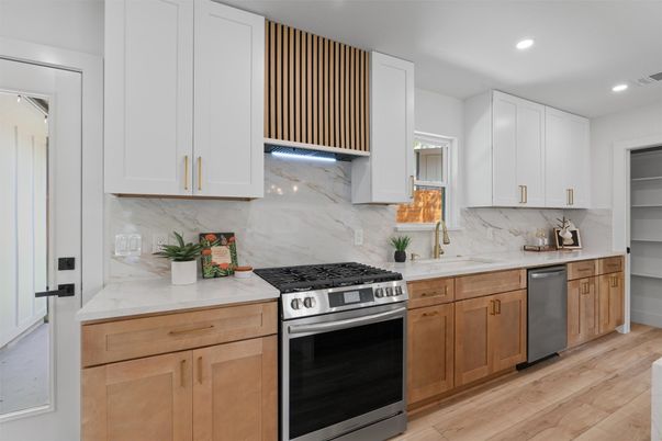 Interior, Kitchen, Marble Walls, Recessed Lighting, Stainless Steel Appliances, Wood Texture Flooring