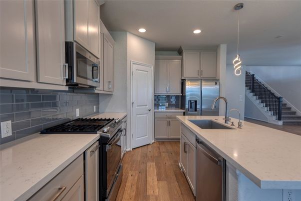 Interior, Kitchen, Pendant Lights, Recessed Lighting, Stainless Steel Appliances, Wood Texture Flooring