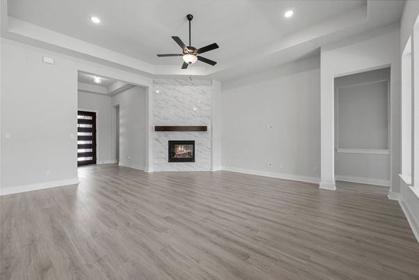 Empty room, Fireplace, Interior, Marble Walls, Recessed Lighting, Wood Texture Flooring