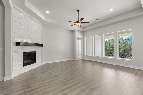 Empty room, Fireplace, Interior, Marble Walls, Recessed Lighting, Wood Texture Flooring